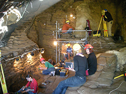 Inside caves at the southern most tip of South Africa, scientists and students work to excavate artifacts from over 50,000 years of human activity. Image by Curtis Marean.
