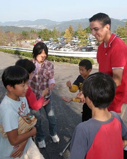 Some kids playing rock, paper, scissors.